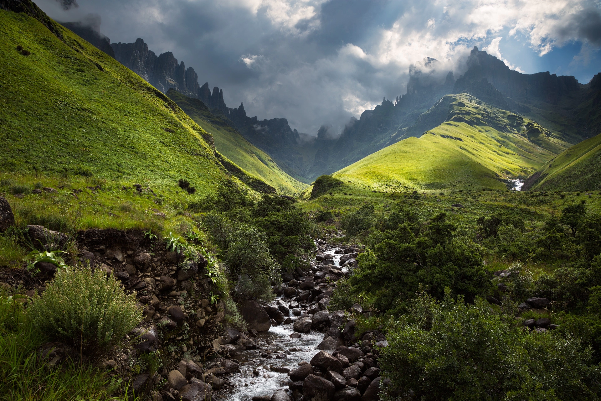 Fine Art African Landscape Photograph of river running from Fangs Pass in the Drakensberg of Southern Africa