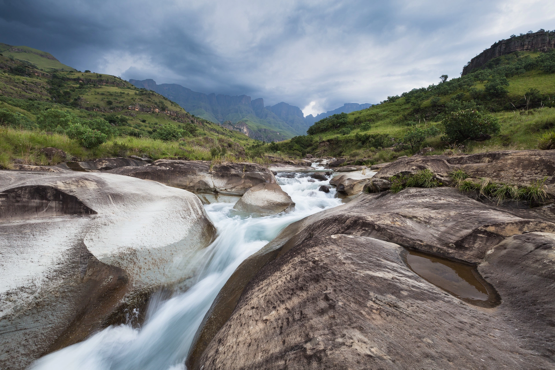 Fine Art African Landscape Photograph of a river in the Drakensberg running through a Drakensberg Valley